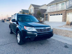 2010 Subaru Forester with all-wheel drive, clean and well-maintained, parked in a residential neighborhood.