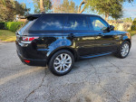 2017 Land Rover Range Rover HSE in black, parked on street, showcasing sleek design and luxury features.