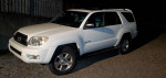 2005 Toyota 4Runner SR5 4WD parked at night showcasing its V8 engine and tow package features.