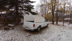 1991 Ford F150 truck with camper shell in good condition parked in a snowy outdoor setting