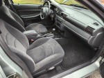 Interior view of a 2005 Dodge Stratus SXT showing spacious seating and dashboard features.