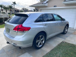 Silver 2010 Toyota Venza parked, showing clean exterior and distinctive design, ready for sale in Punta Gorda.