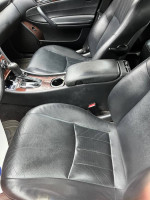 Interior view of a well-maintained 2006 Mercedes-Benz C280 4 MATIC with black leather seats.