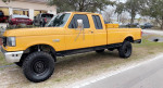 1990 Ford F250 IDI Diesel truck in yellow with black wheels, one owner, rust-free, stored in California.