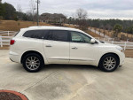 2013 Buick Enclave FWD in white color, featuring alloy wheels and spacious interior, parked outdoors