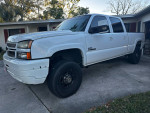 2006 Chevrolet Silverado 1500 in white with 81,000 miles, showcasing its robust 4x4 configuration and upgraded features.