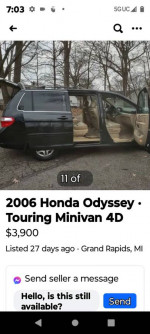 2006 Honda Odyssey Touring minivan in black with open doors showcasing leather interior and features.