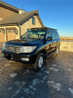 2008 Toyota Land Cruiser with roof rack parked in a picturesque setting for sale