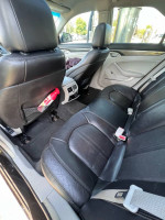 Interior view of a 2011 Cadillac CTS showing black leather seats and clean condition.
