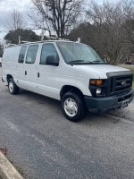 2008 Ford E-150 cargo van with ladder racks and storage bins, runs well, 113,000 miles, available for $5400.