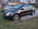 2011 Nissan Sentra sedan in black, automatic with 140,000 miles, great condition and gas saver.