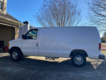 2004 Ford E-250 cleaning van parked outside, equipped with Truckmount carpet cleaning system.