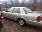 Side view of a 1998 Ford Crown Victoria LX in excellent condition, showcasing its original features and clean exterior.