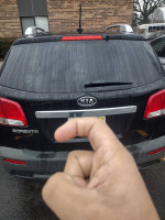 2013 Kia Sorento with damaged rear, available for sale by owner, ideal for mechanics and serious buyers.