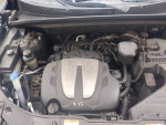 Engine compartment of a 2013 Kia Sorento showing the V6 engine and components.