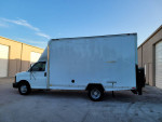 2004 Chevy 3500 Cut Away box truck with liftgate and custom high-top design, parked in industrial area.