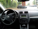 Interior view of 2008 Volkswagen Rabbit showing steering wheel and dashboard controls in good condition.