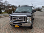 2010 Ford E-350 XLT Super Duty, well-maintained cargo van with passenger seating, large backup camera.