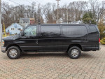 Black 2010 Ford E350 van with cargo space and one bench seat, well-maintained with added features.