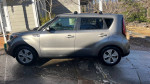 2014 Kia Soul parked outside, showing good condition with minor scratches and recent maintenance.