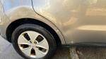 Close-up of the rear wheel of a 2014 Kia Soul showing minor scratches and wear