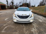 Front view of a 2011 Hyundai Sonata with 57,000 miles, showcasing sleek design and modern features.