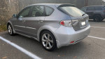 2009 Subaru Impreza Outback Sport in silver parked with detailed exterior features visible