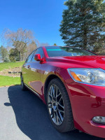 2006 Lexus GS 430 in Matador Red Mica with G Spyder alloy wheels, showcasing its sleek design and pristine condition.