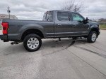 2017 Ford F250 Platinum truck with 98k miles in good condition, featuring a sleek gray exterior.