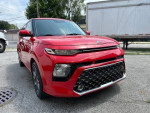 2020 Kia Soul GT-Line in red, showcasing sleek design and alloy wheels, parked with clear sky.