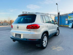 2015 Volkswagen Tiguan SE 4Motion AWD in silver, showcasing rear view and clean condition, featuring new tires and inspection.