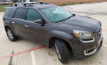 2013 GMC Acadia SLT in gray, showcasing a clean exterior and roof rack, ideal family SUV with new inspection.