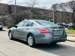 2015 Nissan Altima 2.5 S in good condition with clean exterior, parked on street.
