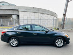 Side view of a black 2015 Nissan Altima 2.5 with clean title and 139k miles, parked on a street.