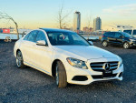 2016 Mercedes-Benz C-Class C 300 4MATIC with 89,000 miles parked by the waterfront, showcasing its sleek design.