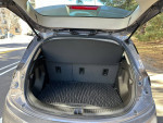 Rear trunk view of a 2023 Chevrolet Bolt 2LT with rubber mat and spacious cargo area