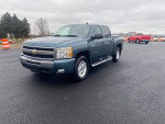2011 Chevrolet Silverado 1500 LT 4WD in blue, parked on asphalt with clean exterior and two-tone interior, ready for sale.