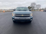 Front view of a 2011 Chevrolet Silverado 1500 LT 4WD, gray color, parked with a clean appearance.