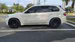2010 BMW X5 with new Vossen 22-inch wheels parked in a Florida lot