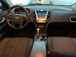 Interior view of a 2010 Chevrolet Equinox with modern dashboard and comfortable seating.
