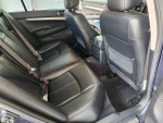 Interior view of a 2009 Infiniti G37x showing leather seats and spacious back row.