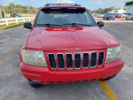 Front view of a red 2001 Jeep Grand Cherokee Limited RWD with clean exterior and no accidents.