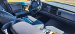 Interior view of a 1995 Buick Roadmaster featuring blue leather seats and dashboard layout.