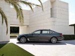 2017 BMW 7-Series 750i x L parked with elegant architecture in the background, showcasing luxury and performance.
