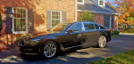 2017 BMW 7-Series 750ix L parked in front of a house, showcasing its elegant design and luxury features