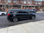 2016 BMW X5 xDrive parked on a street with a clean exterior and sleek design, featuring 360 cameras and all-wheel drive.