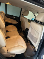Spacious and clean interior of a 2017 Mercedes-Benz GLS 450 SUV with beige seats.