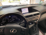 Interior view of a 2012 Lexus RX 350 showing dashboard, navigation screen, and steering wheel.