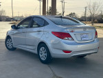 2015 Hyundai Accent GLS in silver, clean and in great running condition, showing rear view on a sunny day.