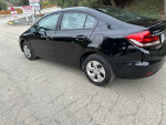 2015 Honda Civic LX in black, showcasing its clean exterior, low mileage, and sleek design.